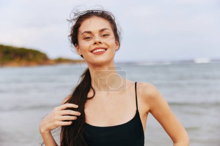 Photo for Woman vacation sunlight smile relax beach sunset coast carefree sky tropical sand walking young lifestyle summer ocean running travel person sea - Royalty Free Image