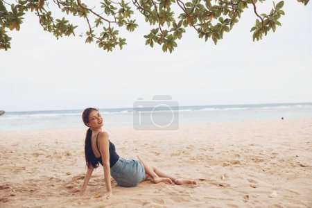 Photo for Person woman adult caucasian sea travel happy white hair freedom sand sitting smile relax vacation long hair beach carefree summer nature body - Royalty Free Image