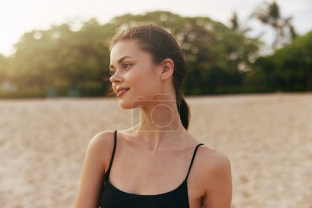 Photo for Walk woman lifestyle young ocean summer beach jean sun happiness enjoyment sea water shore beauty sand vacation smile sunset outdoor leisure - Royalty Free Image