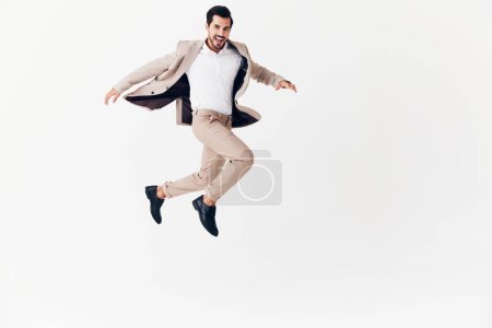 Photo for Man businessman smiling running person beige jumping victory business winner standing flying happy confident idea fashion suit sexy young occupation stylish - Royalty Free Image