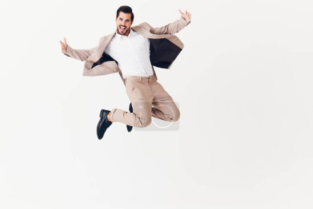 Photo for Man attractive occupation businessman victory beige smiling adult office jumping winner business running person background flying job suit happy eyeglass young - Royalty Free Image