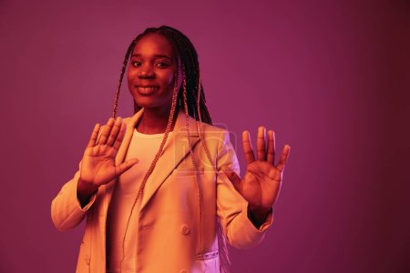 Photo for Woman african american business smile dancing party in neon light, colorful pink color, bright coloring. High quality photo - Royalty Free Image