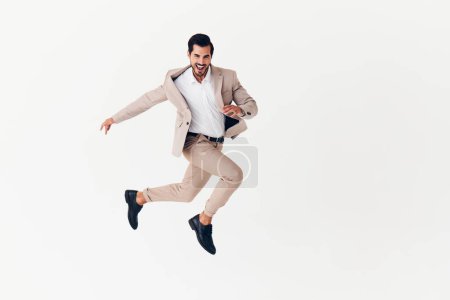Photo for Job man beige studio success business idea happy model male businessman victory stylish smiling occupation winner background running flying arm suit - Royalty Free Image