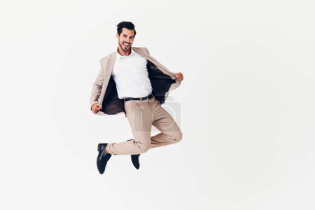 Photo for Running man happy smiling standing business victory businessman suit copyspace confident professional winner adult beige flying portrait idea attractive tie job jacket - Royalty Free Image