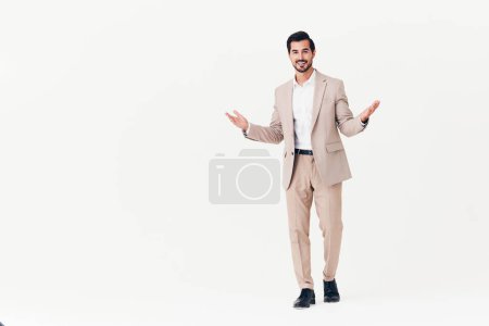 Photo for Man standing model flying person adult smiling business happy winner office copyspace beige running male stylish confident suit jumping businessman victory - Royalty Free Image
