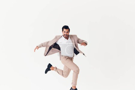 Photo for Man copyspace smile happy person occupation business running suit arm winner tie up male victory stylish businessman beige office smiling jumping - Royalty Free Image