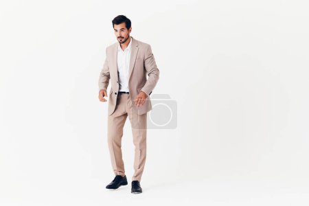 Photo for Suit man adult happy white copyspace beard business sexy winner background smiling businessman work beige victory smile arm running occupation standing - Royalty Free Image
