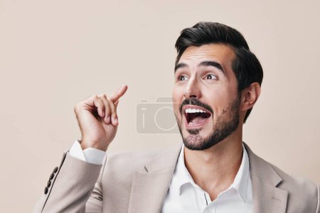 Photo for Man studio professional successful portrait tie businessman background smile winner fashion standing posing happy eyeglass hand beige arm suit victory business - Royalty Free Image