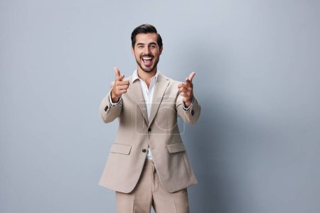 Photo for Hand man fashion winner occupation smiling job cheerful suit business happy office successful beard person arm beige businessman background attractive adult victory - Royalty Free Image
