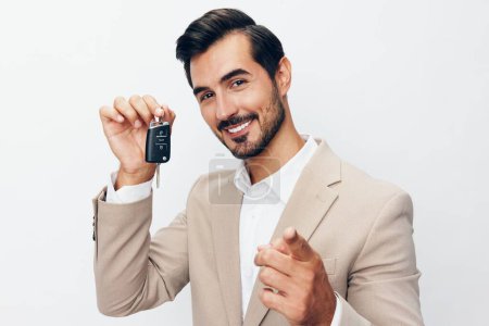Photo for New man service holding sale isolated giving key auto business customer buy keyboard security driver happy businessman car hand smile lock - Royalty Free Image