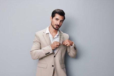 Photo for Young man grey copyspace male crossed fashion sexy suit businessman smiling handsome attractive office happy tie portrait occupation business studio beige - Royalty Free Image