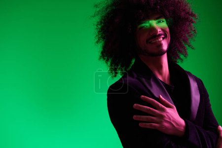 Photo for Portrait of a stylish man in a jacket on a green background multinational, color light, trend. High quality photo - Royalty Free Image