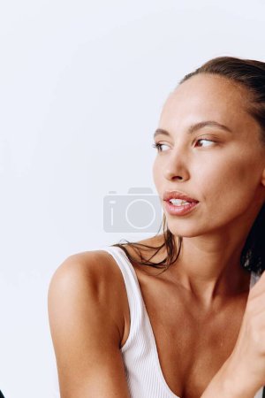 Photo for Portrait of a tanned woman looking into the camera with clear skin on her face without filters or retouching. High quality photo - Royalty Free Image