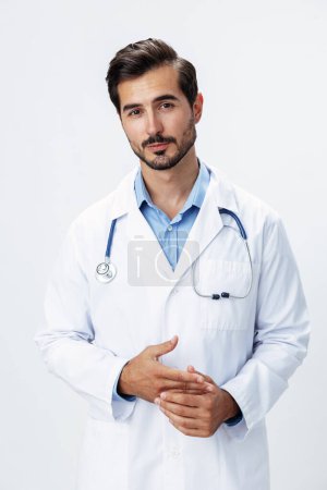 Photo for Man doctor in a white coat with a stethoscope smile with teeth and good test results looking into the camera on a white isolated background, copy space, space for text, health. High quality photo - Royalty Free Image