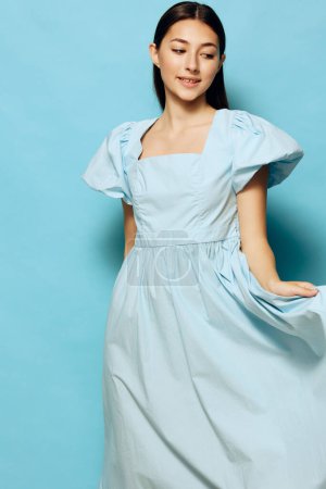 Photo for Woman happy studio relax beautiful trendy blue glamour joy lady model dress young style smile clothes pretty fashion summer pastel lifestyle - Royalty Free Image