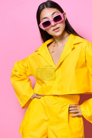 Photo for Sunglasses woman pink happy beautiful girl lifestyle attractive person fashion modern isolated young female yellow brunette expression portrait trendy cheerful fun - Royalty Free Image