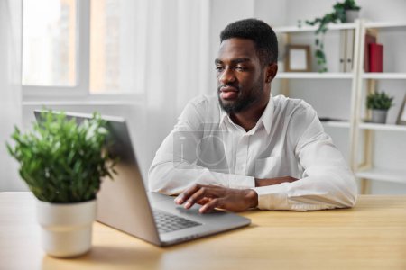 Photo for Man space entrepreneur computer freelancer laptop online student black distance american african workplace looking person work office communication copy male job technology education - Royalty Free Image