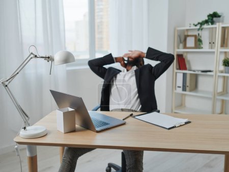 Photo for African man work sitting modern american job indoor entrepreneur workplace cyberspace online laptop computer table chat student worker office freelancer african education - Royalty Free Image