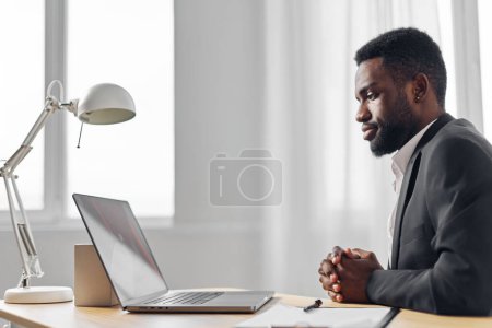 Photo for Man office freelancer freelance laptop corporate programmer american workplace online student african conference education sitting chat table manager cyberspace web computer job - Royalty Free Image