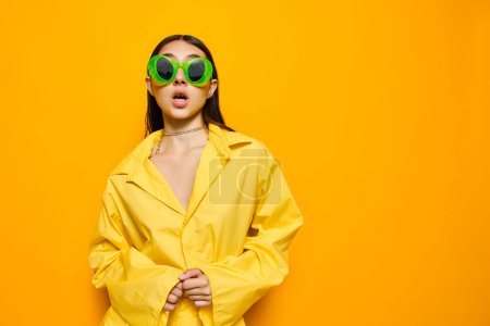 Photo for Isolated woman glamour lady studio caucasian female attractive cheerful girl trendy beautiful gesture young yellow fashion fun lifestyle dance romance sunglasses - Royalty Free Image