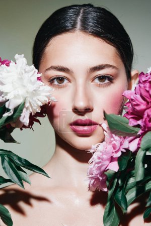 Photo for Bouquet woman closeup portrait girl blush make-up pink face spa brunette beautiful model skin flower person concept health beauty lady treatment beauty - Royalty Free Image