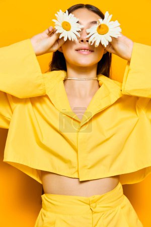 Photo for Girl woman model lady pretty studio positive happy smile romance care emotion flower young chamomile isolated brunette portrait yellow happiness fun - Royalty Free Image
