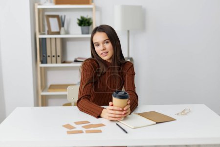 Photo for Girl studying lifestyle education exam class learn teenager table indoor desk caucasian sitting alone preparation notebook student apartment stress schoolgirl - Royalty Free Image