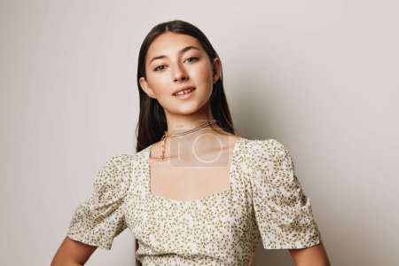 Photo for Woman smiling girl hairstyle brunet face cosmetic rustic beige beauty portrait dress smile lip background female caucasian person body makeup young romantic - Royalty Free Image