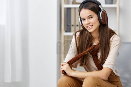 Photo for Space woman earphones relax copy meditation headphones girl lifestyle happy sitting smile stylish teenage music phone chair portrait technology pretty female - Royalty Free Image