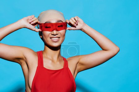 Photo for Beauty woman sunglasses attractive cheerful portrait cute lifestyle vacation white emotion red smiling blue black glamour tan fashion goggles asian adult swimsuit - Royalty Free Image