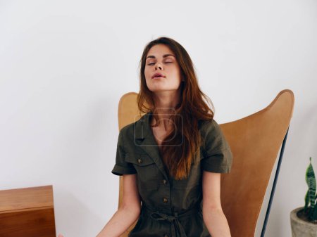 Photo for Woman model sits on a chair at home smile, fun and relaxation, modern stylish interior scandia lifestyle, copy space. High quality photo - Royalty Free Image