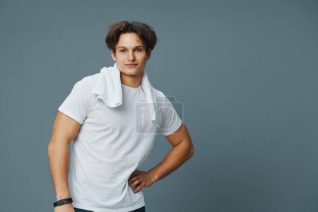 Photo for Man sport strong naked shot white caucasian fashion young handsome guy torso fit body lifestyle towel model training background athletic t-shirt attractive - Royalty Free Image