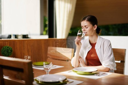 Photo for Dinner women table lunch caucasian young adult beauty lady wine one meal lifestyle restaurant red person attractive food female - Royalty Free Image