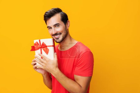 Photo for Give man male model party box gift studio copy gift happy space valentine box holiday sale birthday holding celebrate surprise celebration guy present christmas - Royalty Free Image
