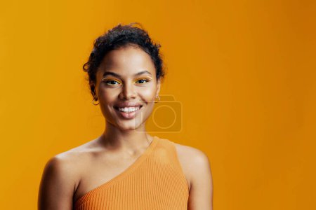 Photo for Woman creative beauty african skin ethnic model fashion colourful make-up black space face cosmetic portrait eye copy yellow pink studio cosmetology smile style beautiful - Royalty Free Image