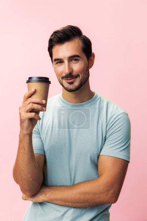 Photo for Insomnia man fashion student hot space go isolated paper mug smile sleep energy t-shirt happy pink to copy background tea model drink cup studio coffee hipster - Royalty Free Image
