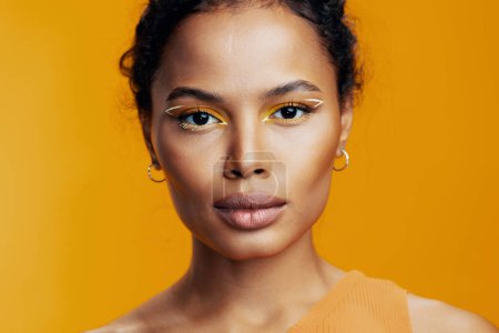 Photo for Woman african happy studio portrait pink creative smile cosmetic skin space ethnic face beautiful model fashion colourful eye style cosmetology copy make-up black beauty yellow - Royalty Free Image
