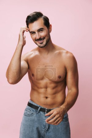 Photo for Body man muscle model sexy bicep naked pink fashion sport jeans belt muscular lifestyle fitness shirtless beauty holiday background torso - Royalty Free Image