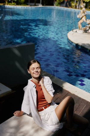 Photo for Woman holiday leisure vacation healthy attractive young body adult fashion caucasian pretty relaxing lifestyle pool person summer swim portrait beauty water blue female - Royalty Free Image