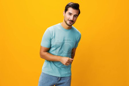 Photo for Portrait man model arm style happy lifestyle attractive business trendy isolated laughing fashion expression gesture yellow confident smiling background cheerful copy smile space studio guy - Royalty Free Image