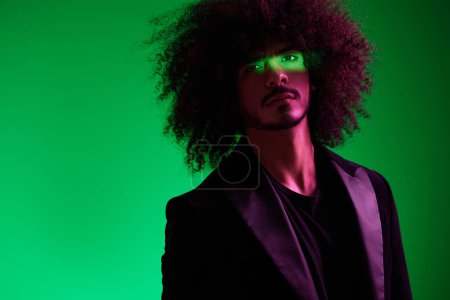 Photo for Portrait of a stylish man in a jacket on a green background multinational, color light, trend. High quality photo - Royalty Free Image