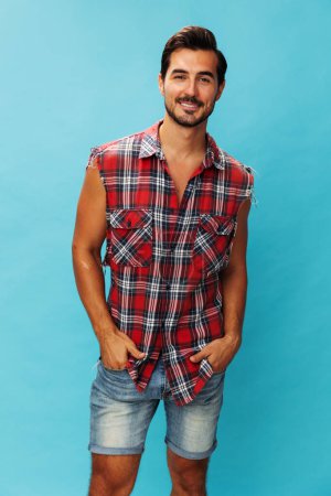 Photo for Man background success shirt vacations guy isolated looking standing friendly arm attractive smile travel blue confident beard cheerful business portrait trendy happy studio plaid crossed - Royalty Free Image