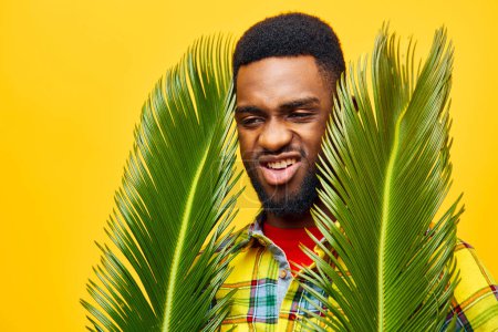 Photo for Man emotion skin yellow leisure model american happy african palm multiethnic background tree black fashion copyspace african trendy tropical young stylish palm fun - Royalty Free Image