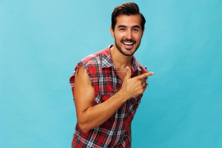Photo for Man blue friendly trendy success isolated shirt happy beard attractive guy travel background smile confident arm plaid business portrait crossed cheerful standing vacations studio looking - Royalty Free Image
