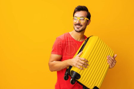 Photo for Baggage man weekend vacation lifestyle hipster traveler travel flight yellow space holiday studio journey guy trip suitcase copy happy background yellow - Royalty Free Image