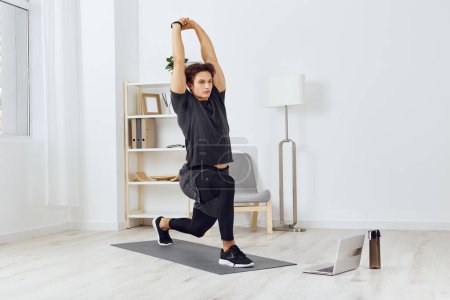 Photo for Fitness man abs sportswear sport adult home house room lifestyle indoor apartment hobby workout person muscular training activity healthy health young - Royalty Free Image