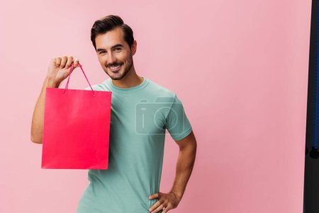 Photo for Gift man bag buy client surprise holiday shop store portrait background women pink day isolated shopper lifestyle happy purchase discount fashion sale present package - Royalty Free Image