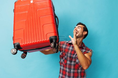 Photo for Tour man voyage guy suitcase weekend hipster background space flight holiday baggage copy style happy vacation journey red lifestyle ticket traveler luggage travel blue trip studio - Royalty Free Image