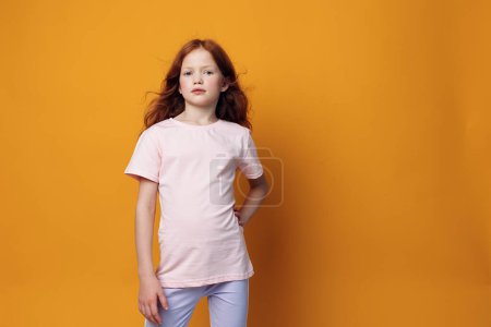 Photo for Woman person small kid girl fashion expression look childhood face white female little background t-shirt beauty young cute pretty hair children - Royalty Free Image