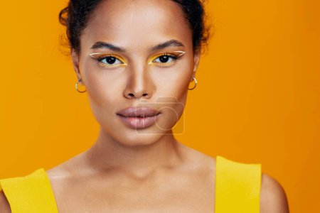 Photo for African woman colourful portrait black cosmetology copy yellow pink style model make-up studio space fashion creative skin cosmetic beautiful smile beauty face - Royalty Free Image